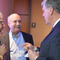 T.Haas enjoys conversation with two alumni